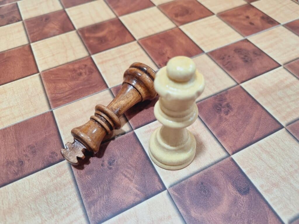 chess queen defeating king chess